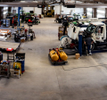 Panorama view of a working warehouse with trucks. 